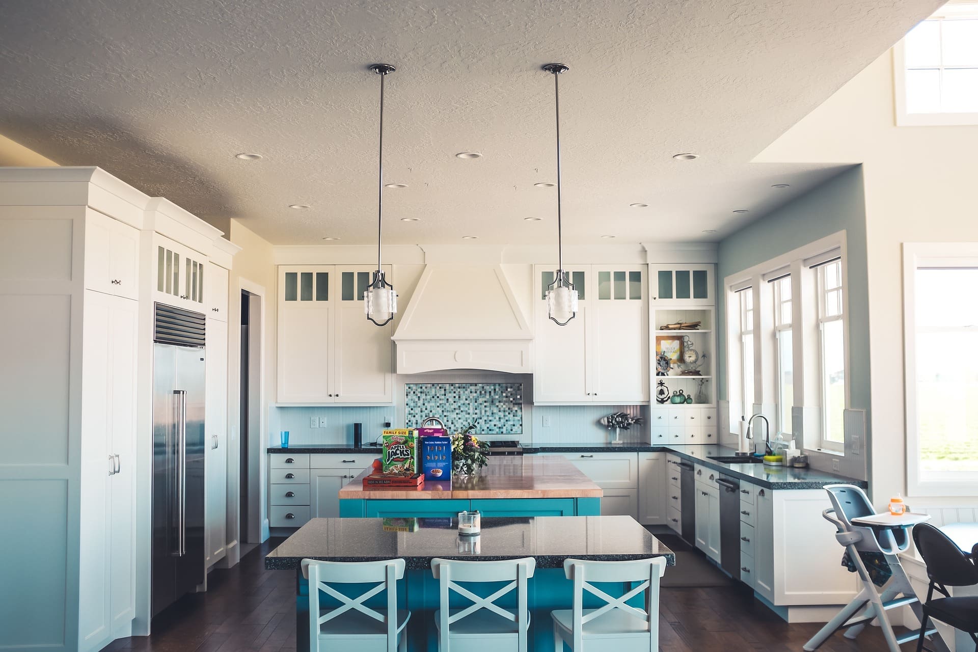 luxury kitchen with island and chairs