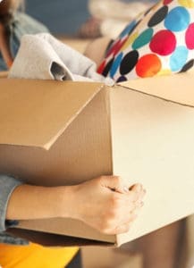 a woman carrying a box